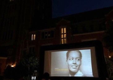 Outdoor film screening in the Pauli Murray courtyard