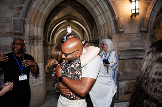 Two Yale alumni hugging each other