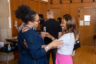 Two Yale alumni embracing each other at reunion event