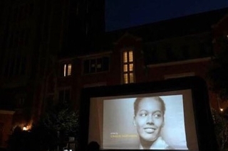 Outdoor film screening in the Pauli Murray courtyard